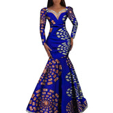 A long-sleeved, blue African wax print mermaid dress with a sweetheart neckline.