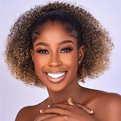 A woman wears a short, kinky curly afro drawstring ponytail hair extension in a highlighted brown.