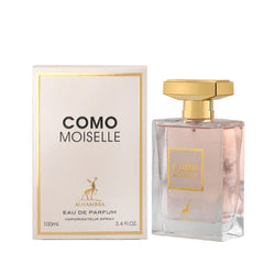 A bottle of Alhambra Como Moiselle eau de parfum next to its white and gold rectangular box.