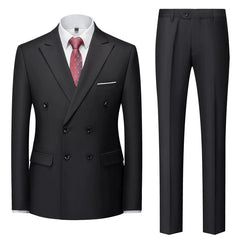 A black double-breasted suit with a white shirt and a patterned red tie.