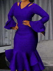 A royal blue knee-length bodycon dress with cold shoulder cutouts, long flared sleeves, and ruffles.