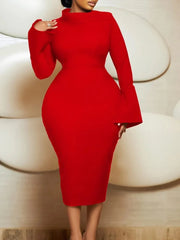 A woman wears a red, long-sleeved, mid-calf bodycon dress with an asymmetrical neckline.