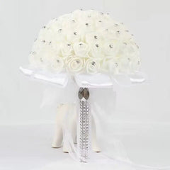 A white foam rose bridal bouquet decorated with rhinestones and a dangling crystal ribbon accent.