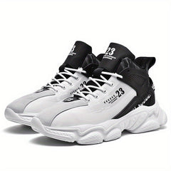 A pair of white and black mid-top men's running shoes with lace-up closures and textured soles.