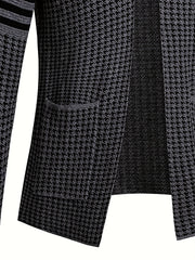 A slim-fit knit cardigan featuring a black and grey houndstooth pattern and a front pocket.
