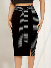 A black midi skirt with a striped waistband and matching tie detail featuring a side slit.