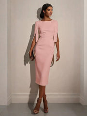 A light pink midi-length bodycon dress with a crew neck and pearl-accented split half sleeves.