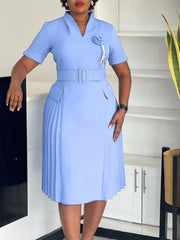 A light blue V-neck dress with short sleeves, a belted waist, and a pleated skirt.