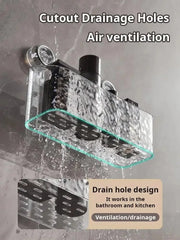A clear plastic wall-mounted shower shelf with drainage holes and suction cup attachments.