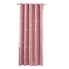 A pink blackout curtain panel featuring a silver printed pattern of stars and moons with grommets.