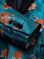 A blue floral jacquard blazer featuring a black shawl lapel and matching black sleeve buttons.