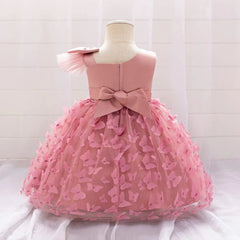 A pink baby girl's party dress featuring a tulle skirt with butterfly appliqués and a back bow.