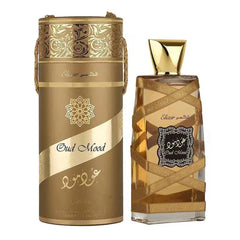 A bottle of Lattafa Oud Mood Elixir perfume next to its matching gold cylindrical gift box.