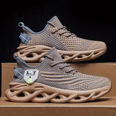 A pair of tan breathable mesh sneakers with unique blade-style soles and lace-up closures.