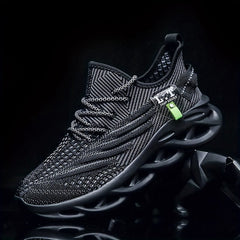 Black breathable mesh sneakers with a geometric pattern and a unique blade-style sole.