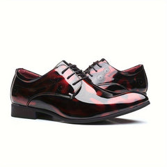 Men's glossy oxfords in a dark red floral pattern with a pointed toe and lace-up closure.