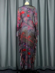 A brown ankle-length sheath dress with a dark abstract print, long sleeves, and side ruffles.