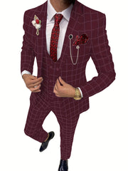 A man wears a slim-fit burgundy plaid three-piece suit with a white shirt and patterned red tie.