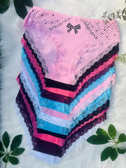 A stack of twelve colorful cotton briefs featuring contrast lace trim and a bow detail.