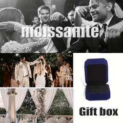 A marquise shaped moissanite ring displayed with a blue velvet gift box.