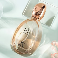 A bottle of DICOO floral perfume for women with a rounded glass design and a metallic cap.