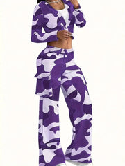 A woman wears a purple and white camouflage print two-piece set with a cropped top and cargo pants.