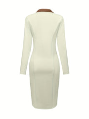 A back view of a cream-colored long-sleeved midi dress with a brown lapel collar.