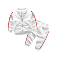 A white baby boy sports set featuring a zip-up bomber jacket and pants with red side stripes.