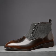 A men's brown pointed-toe ankle boot featuring a herringbone fabric upper and side zipper closure.