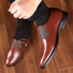 A pair of brown slip-on men's loafers featuring a rounded toe and breathable mesh detailing.