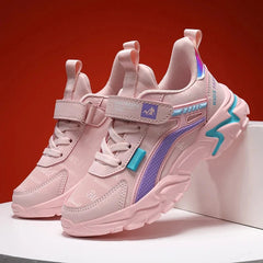 A pair of pink casual sneakers for girls featuring a hook-and-loop strap and chunky soles.