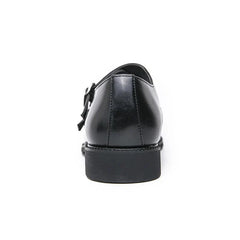 A rear view of a black leather monk strap dress shoe with a pointed toe and a thick rubber sole.