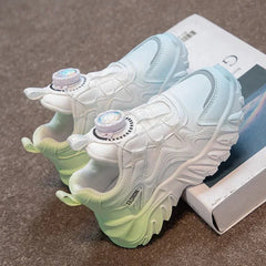 A pair of white and light green children's sneakers with a dial closure system.