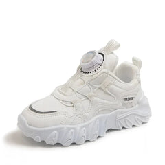A white children's sneaker with a chunky sole, mesh upper, and a rotating dial closure system.
