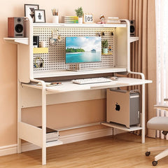 A modern white computer desk with an integrated pegboard, shelving, and a lower storage platform.