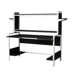 A modern computer desk with a black desktop, integrated shelving, and a white metal frame.