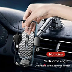 A hand places a smartphone into an adjustable suction cup car phone mount on a dashboard.