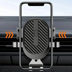 A carbon fiber patterned car phone holder mounted on a vehicle air vent.