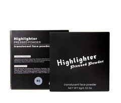 Two black boxes of translucent pressed powder highlighter shown from front and side angles.