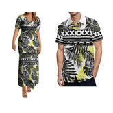 A woman in a long Polynesian print dress and a man in a matching short-sleeve shirt.