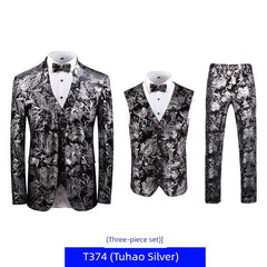 A three-piece suit featuring a black and silver floral print with a blazer, vest, and trousers.