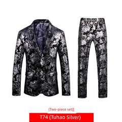 A two-piece suit featuring a black blazer and matching trousers with a silver floral print.
