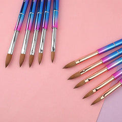 A set of professional Kolinsky acrylic nail brushes with colorful metallic handles.