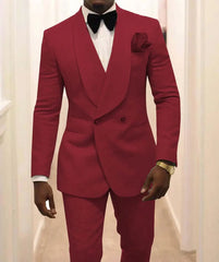 A man wears a red double-breasted suit with a shawl lapel, white shirt, and black bow tie.