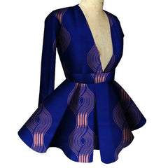 A long-sleeved blue peplum top with a deep V-neck and a pink wavy geometric print.