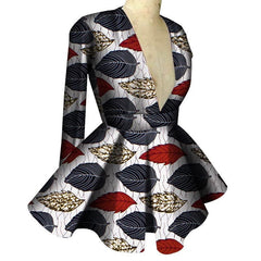 A long-sleeved peplum top with a deep V-neckline featuring a white, black, and red leaf print.
