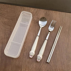 A stainless steel cutlery set featuring a spoon, fork, and chopsticks with cute rabbit handles.