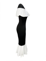 A black bodycon fishtail dress with a white ruffled neckline and hem.