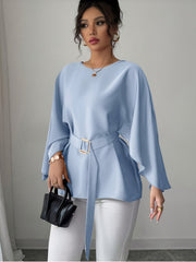 A light blue long-sleeve blouse with a crew neck, split sleeves, and a matching waist belt.