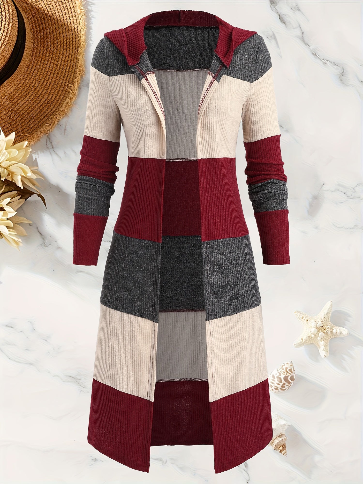 A long-sleeved, hooded cardigan featuring a maroon, grey, and beige color-block knit design.